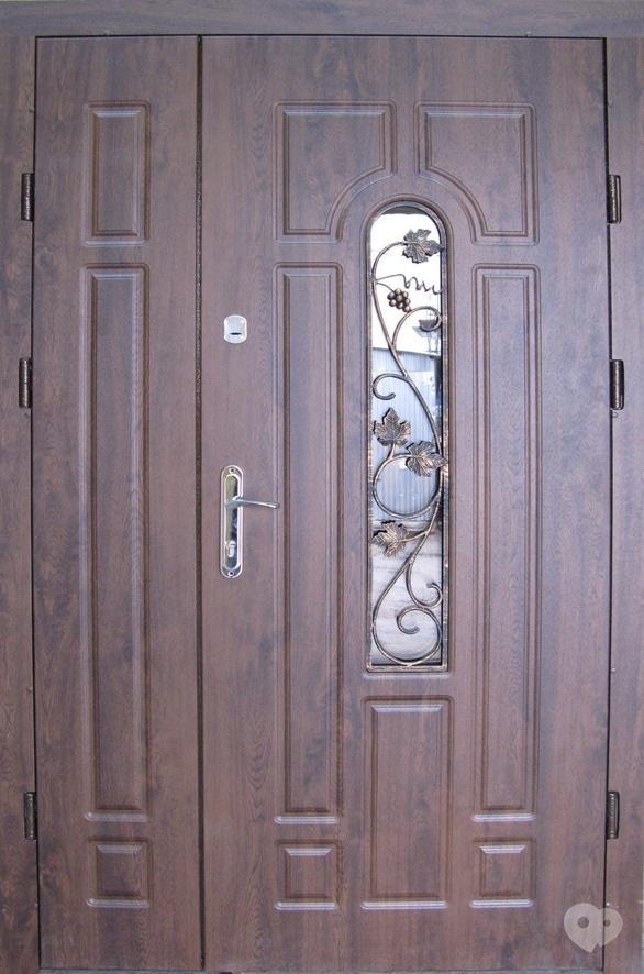 Фото-1 Окна Дар, магазин-салон - Двери входные "1200 Арка с ковкой" улица